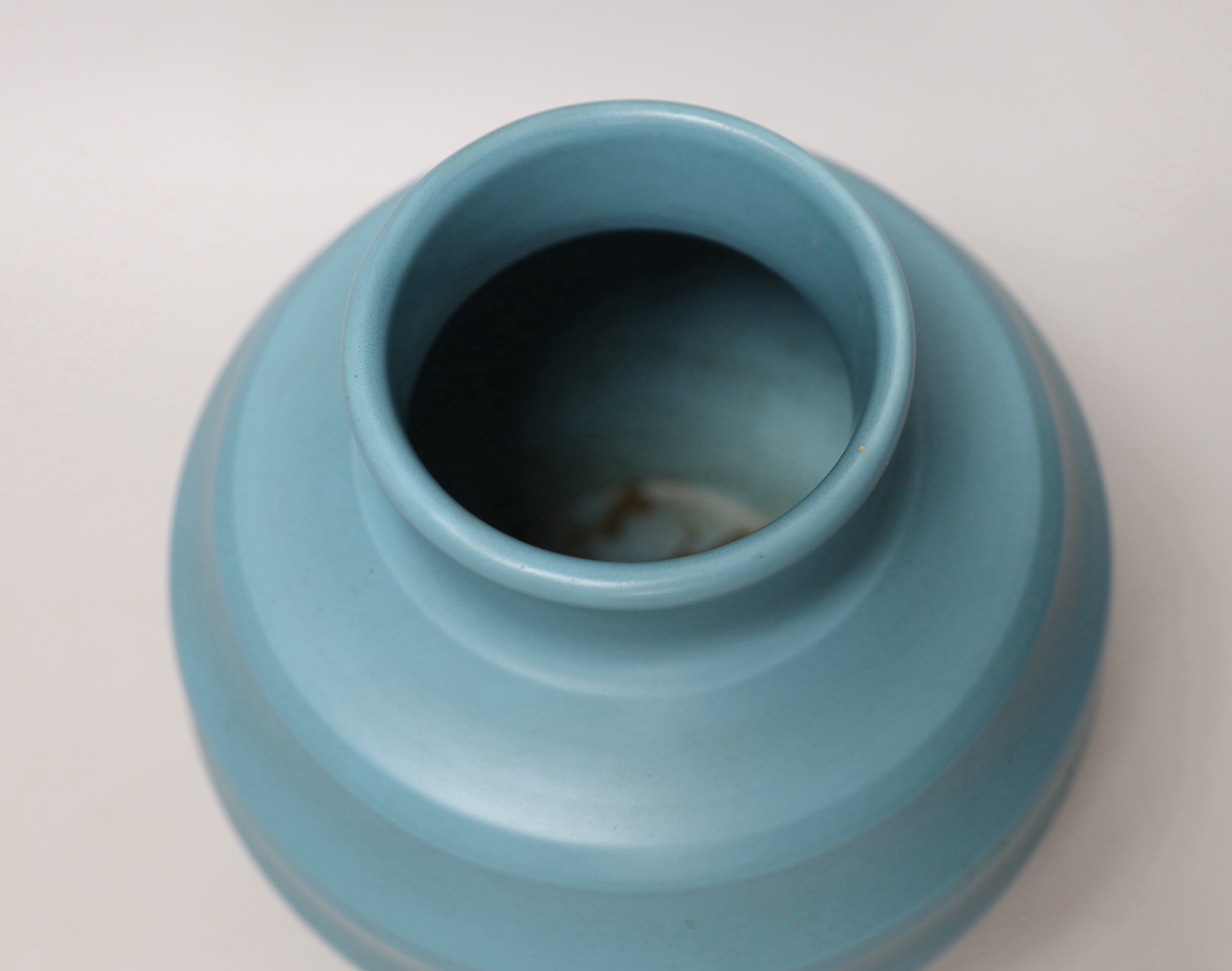 Keith Murray for Wedgwood - a blue glazed ribbed globular vase, 19cm high